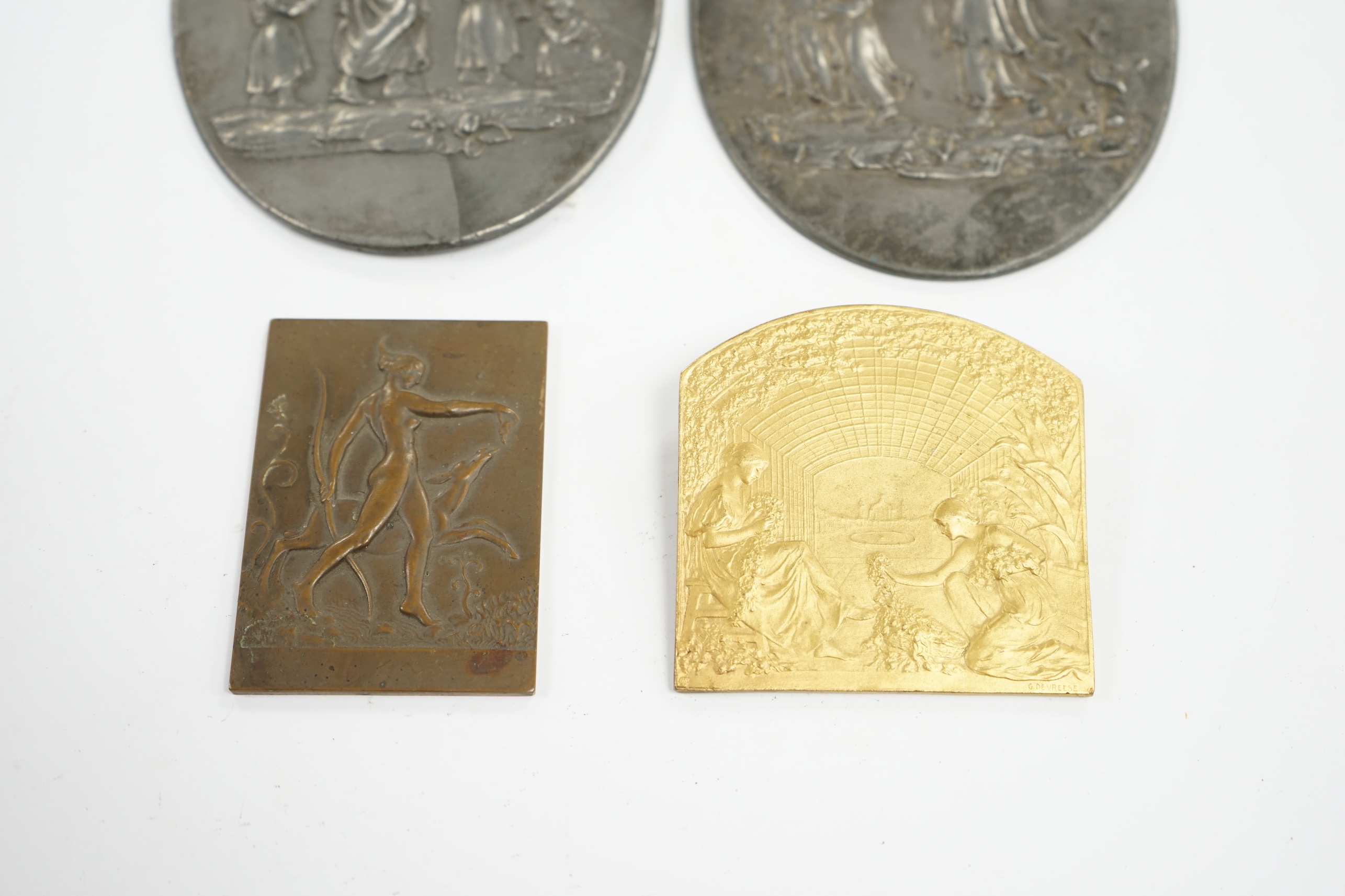 A pair of oval cast pewter plaques inscribed L. Jewitt, Duffield, and two relief-moulded brass plaques, signed Sporrong, Stockholm and G. De Vreese, oval plaques 13cm high. Condition - some marks to surface